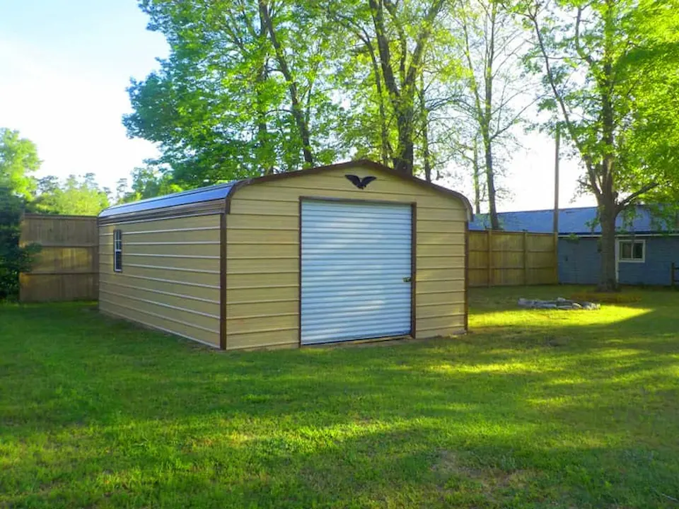 detached single car garage storage building with dirt foundation, built to the standard dimensions of a 1 car garage according to guide to common garage dimensions for metal buildings and metal storage buildings